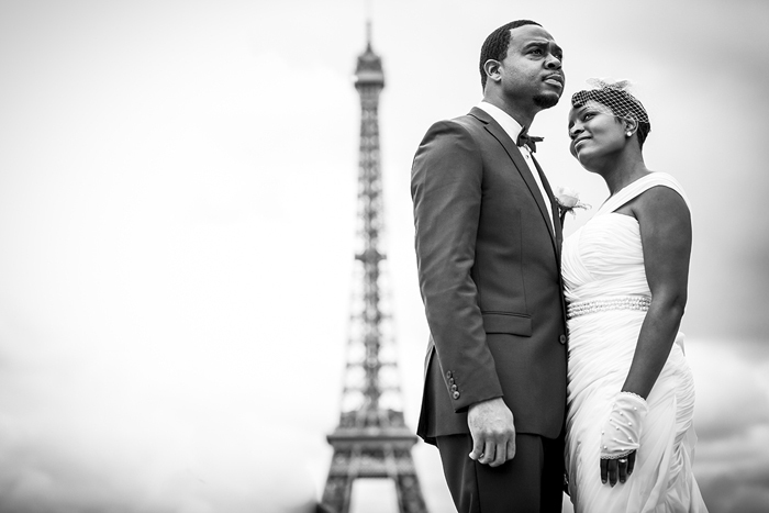 bride and groom in front of eiffel tower