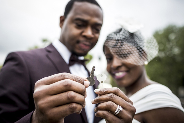 bride and groom with lock keys