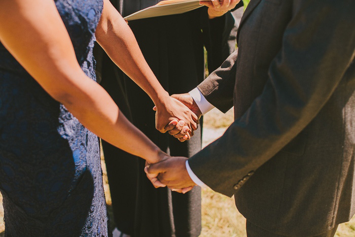 bride and groom holding hands