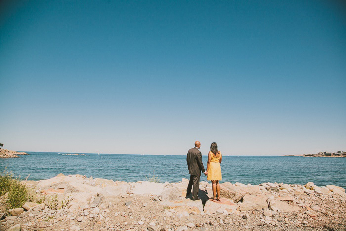 bride and groom walking out to the sea