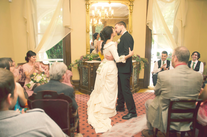 bride and groom first kiss