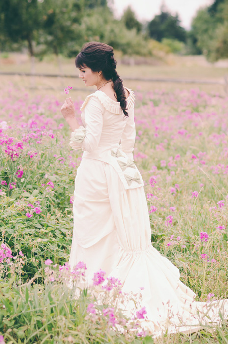 bride in field of flowers