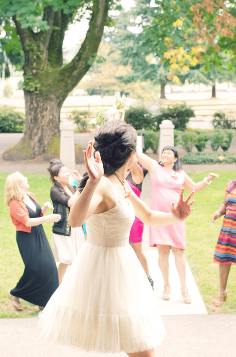 bride tossing the bouquet