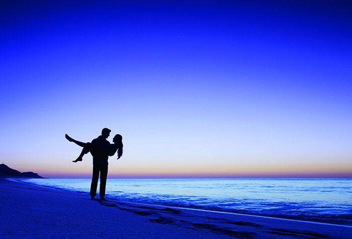 couple on the beach at dusk