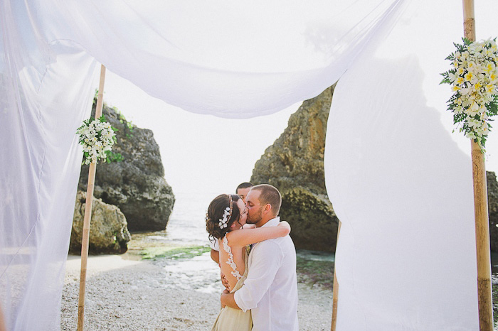 bride and groom first kiss