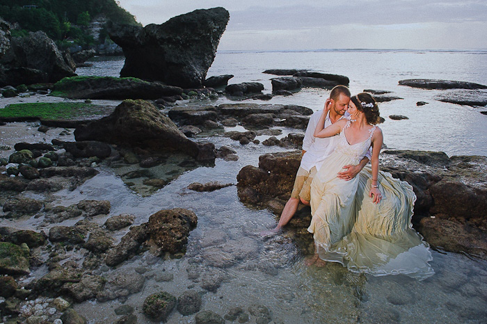 bride and groom by the ocean