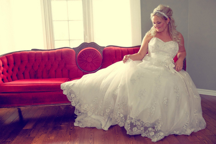 bride on red chaise lounge