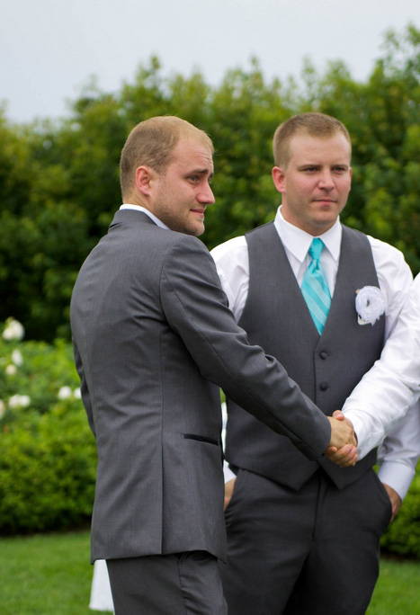 emotional groom at the altar