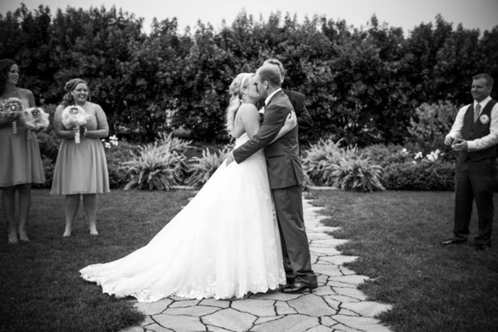 bride and groom first kiss