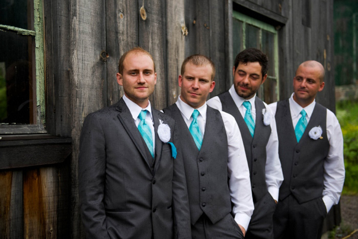 groomsmen in front of barn