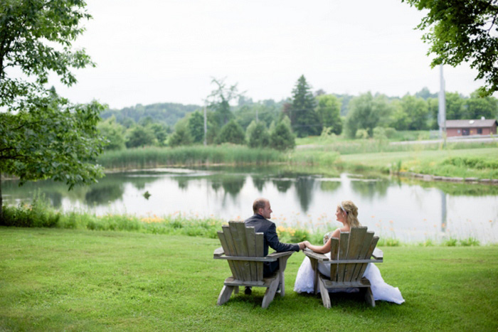 bride and groom in muskoka chairs