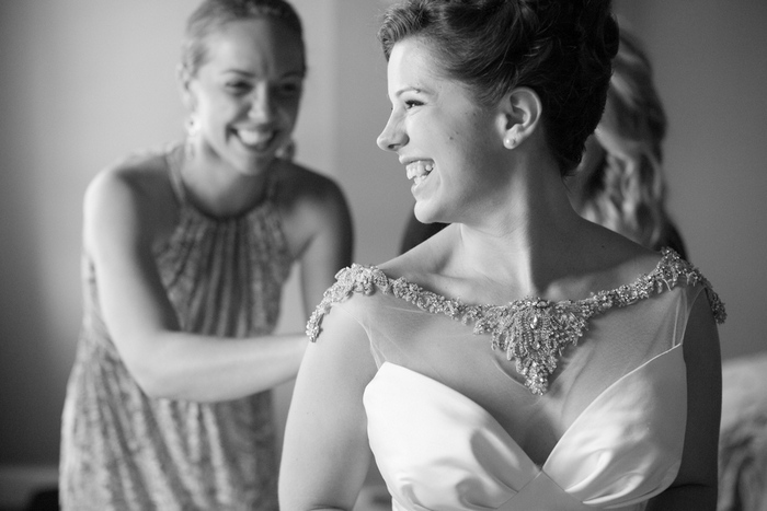 bride laughing with her bridesmaids