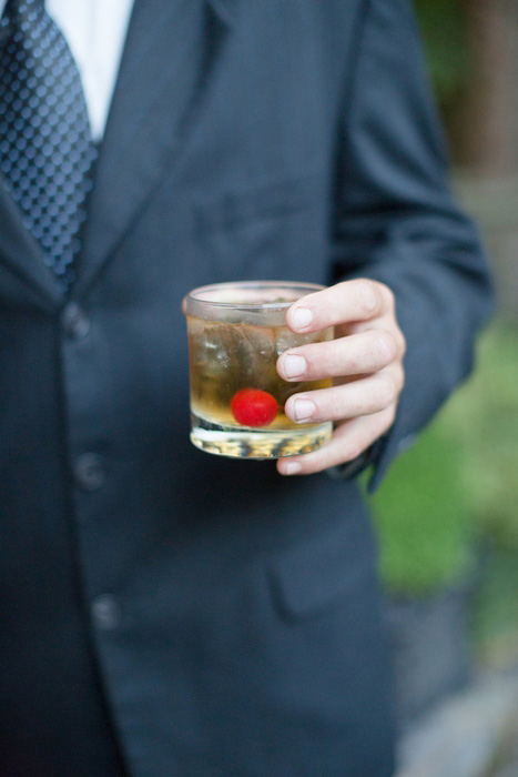 wedding guest with cocktail