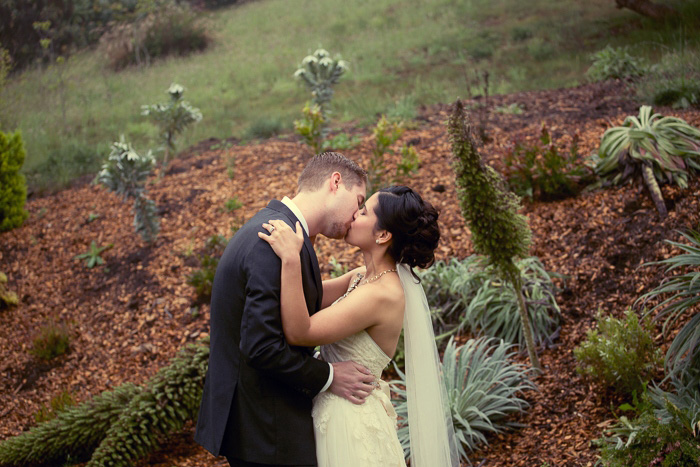 Bride and groom first kiss