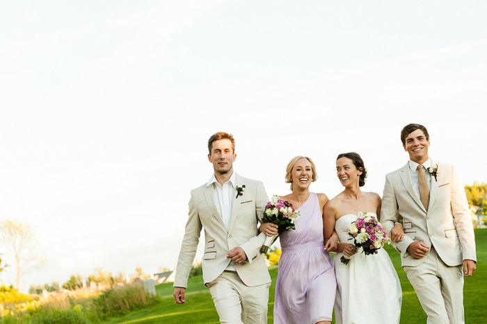 bridal party walking across golf course