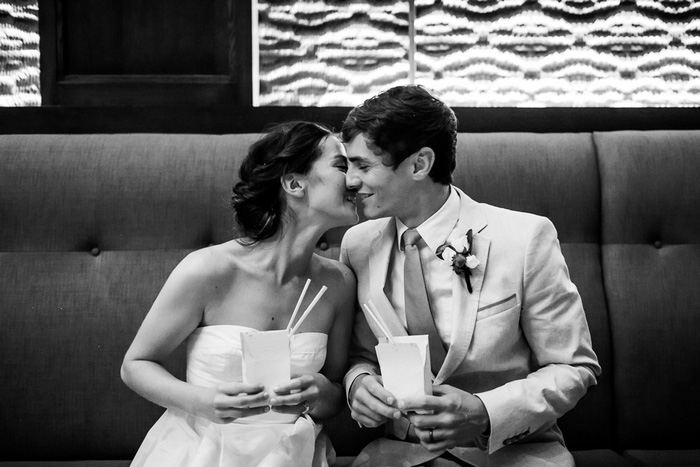 bride and groom kissing at reception