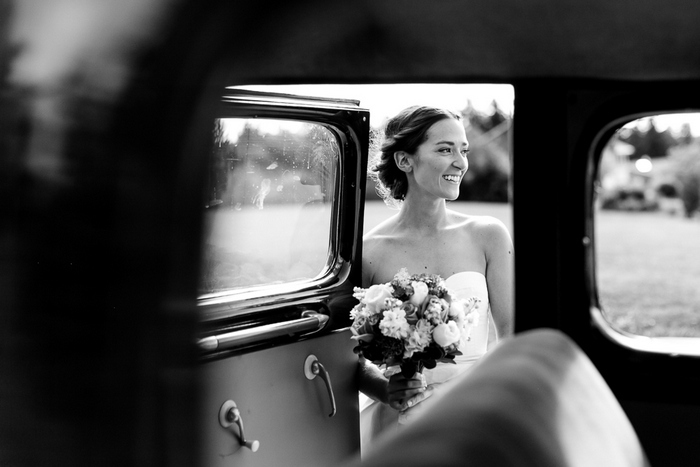 bride getting into vintage car