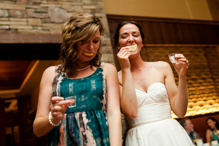 bride and guest doing shots