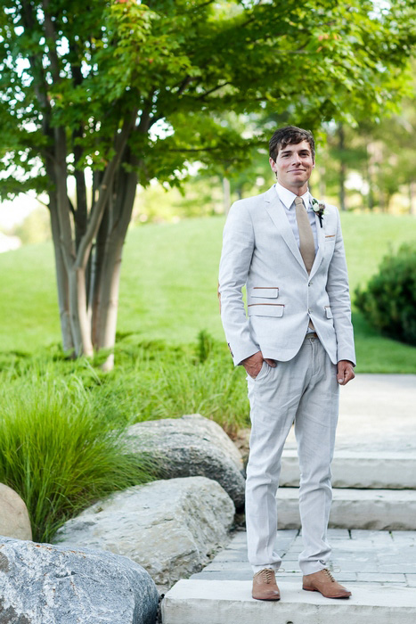 groom in pale suit