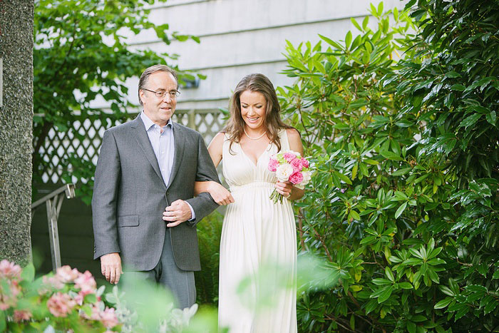 bride walking down the aisle with her father