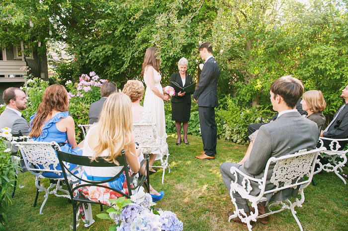 bride and groom at the backyard altar