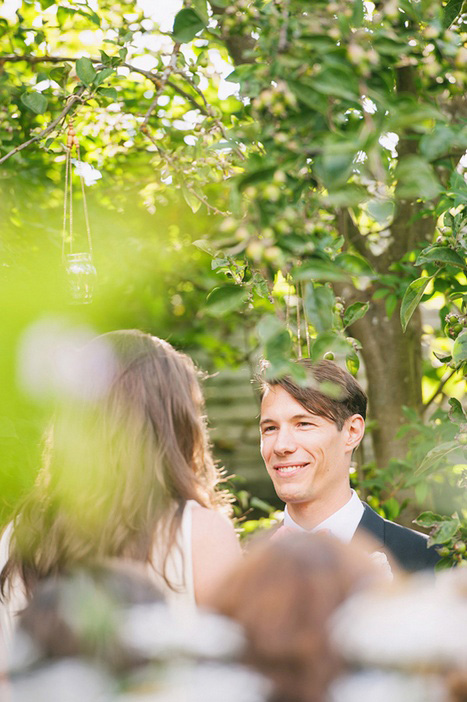 groom looking at his bride during ceremony