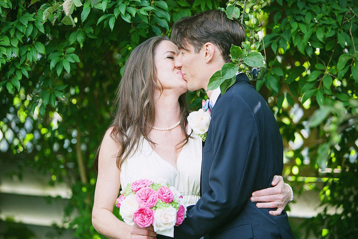 bride and groom first kiss