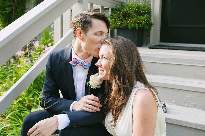 bride and groom kissing on the steps