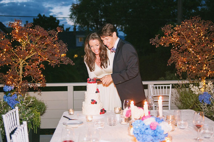 bride and groom cutting the cake