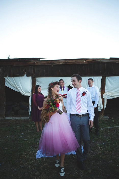 bride and groom walking down the aisle as husband and wife