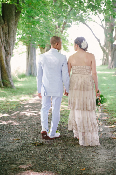 bride and groom walking hand in hand