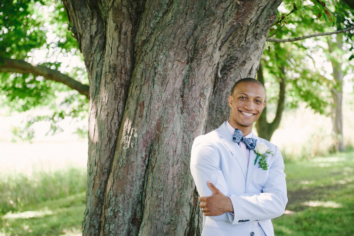 groom in pale blue suit