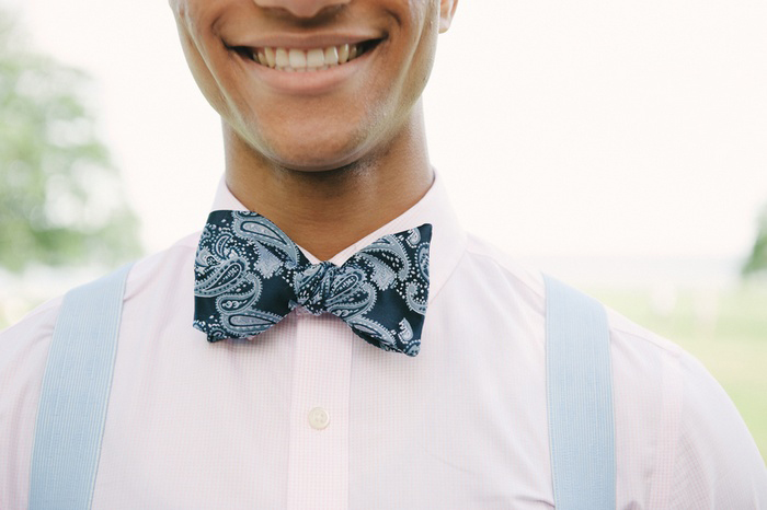 groom in blue paisley bow tie