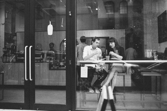 bride and groom at NYC cafe after elopement