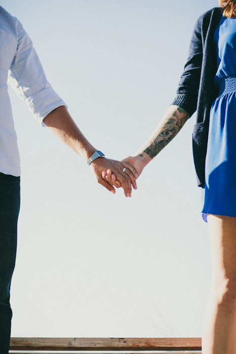 bride and groom holding hands