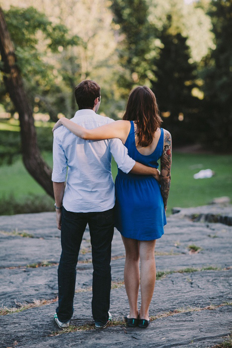 bride and groom walking in the park