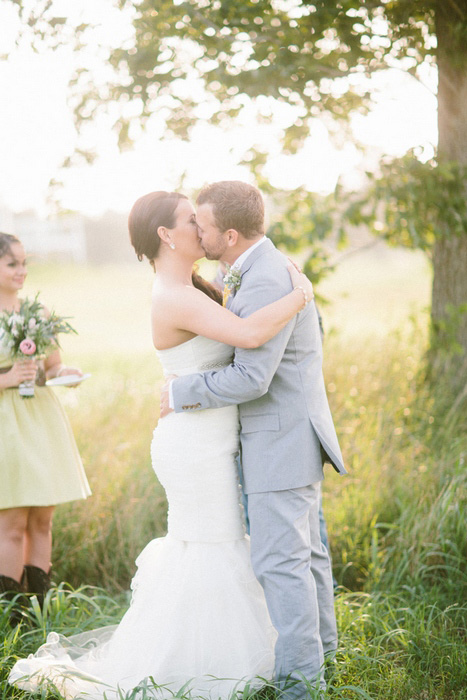 bride and groom first kiss