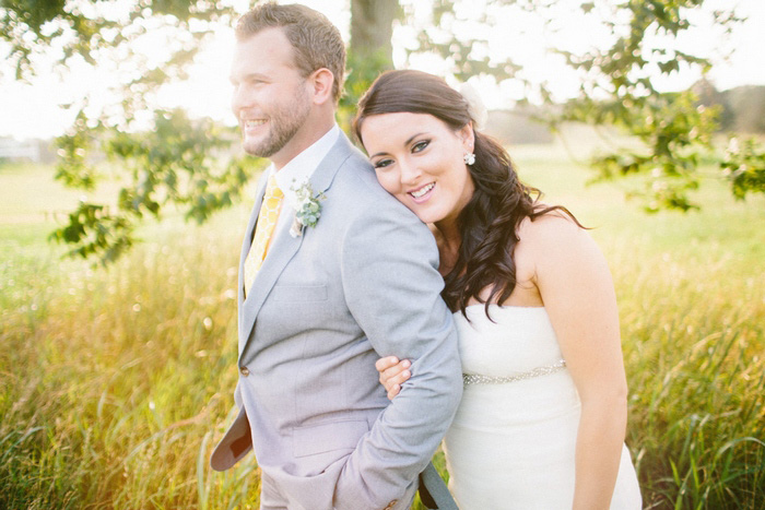 bride and groom in field