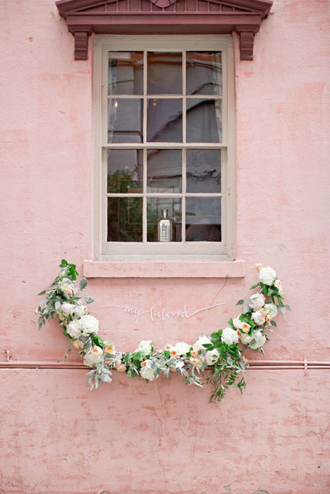 flower-garland-on-pink-wall