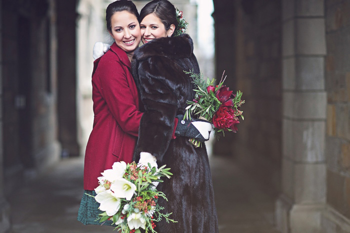 bride and maid of honor hugging