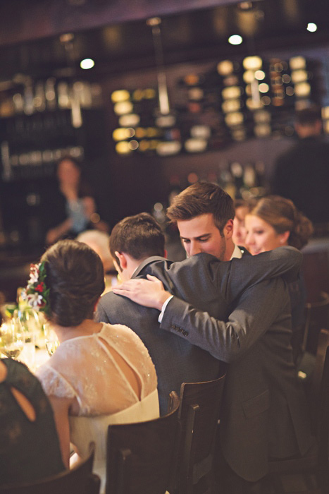 groom huggin his best man