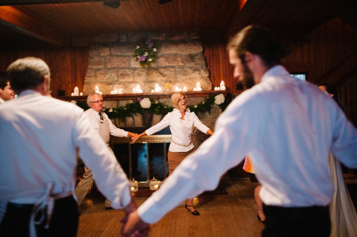 wedding guests dancing holding hands