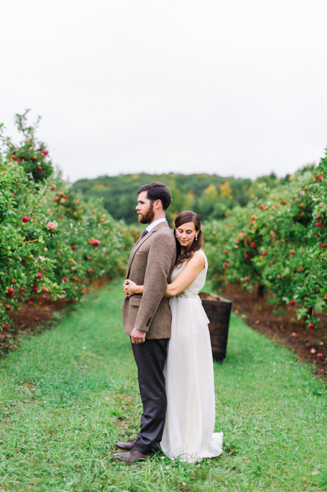 bride and groom in apple orchard