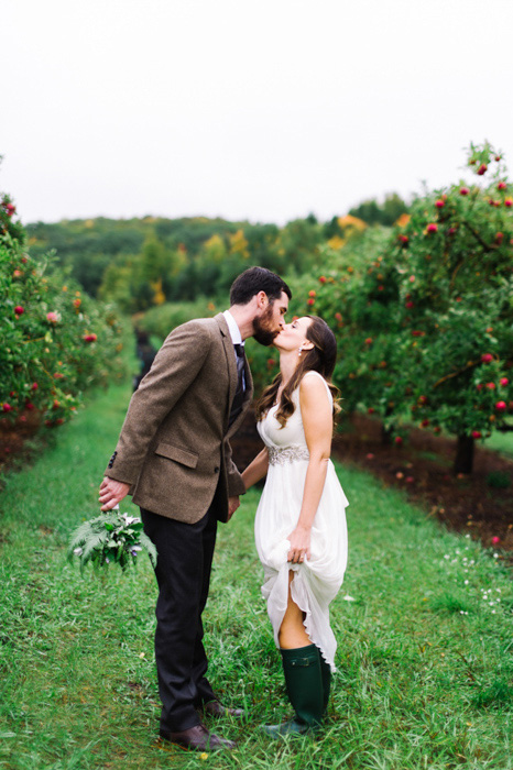 bride and groom in apple orchard