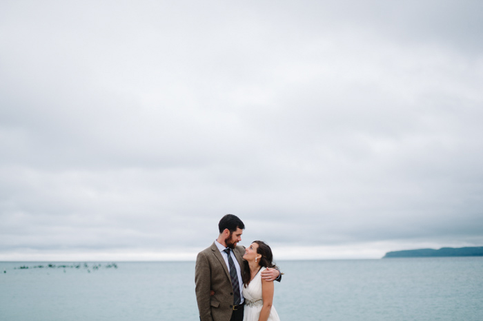 bride and groom by the lake