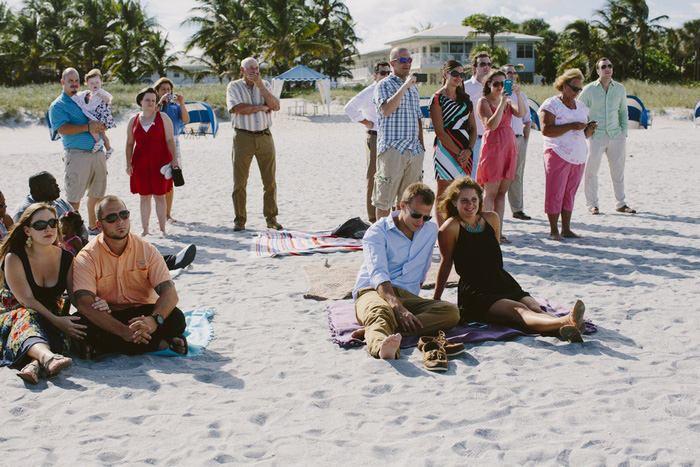 wedding guests on the beach