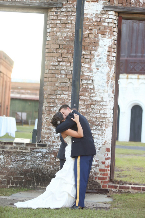 bride and groom first kiss