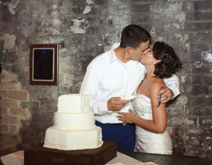 bride and groom cutting the cake