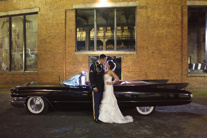 bride and groom with vintage convertible 