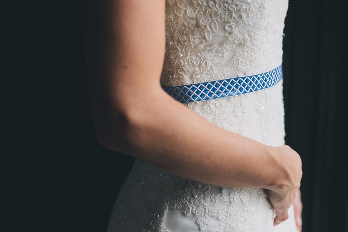 lace wedding dress with blue belt